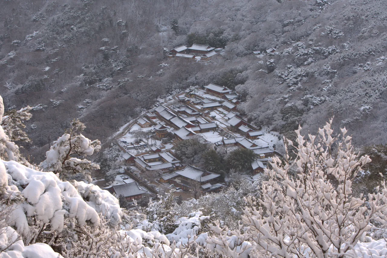Beomeosa Temple roofs and courtyard under winter snow