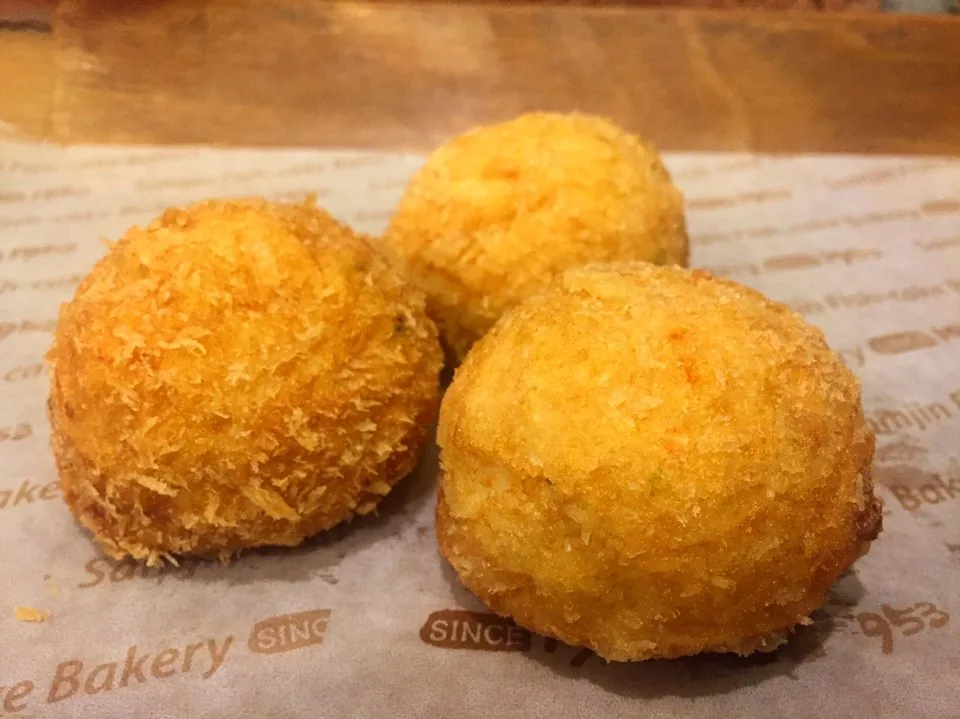 Golden fried eomuk croquettes on bakery paper in Busan Golden fried eomuk croquettes on bakery paper in Busan