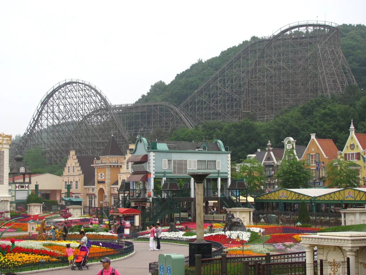 The T Express coaster rising over the European Adventure village and flower beds at Everland