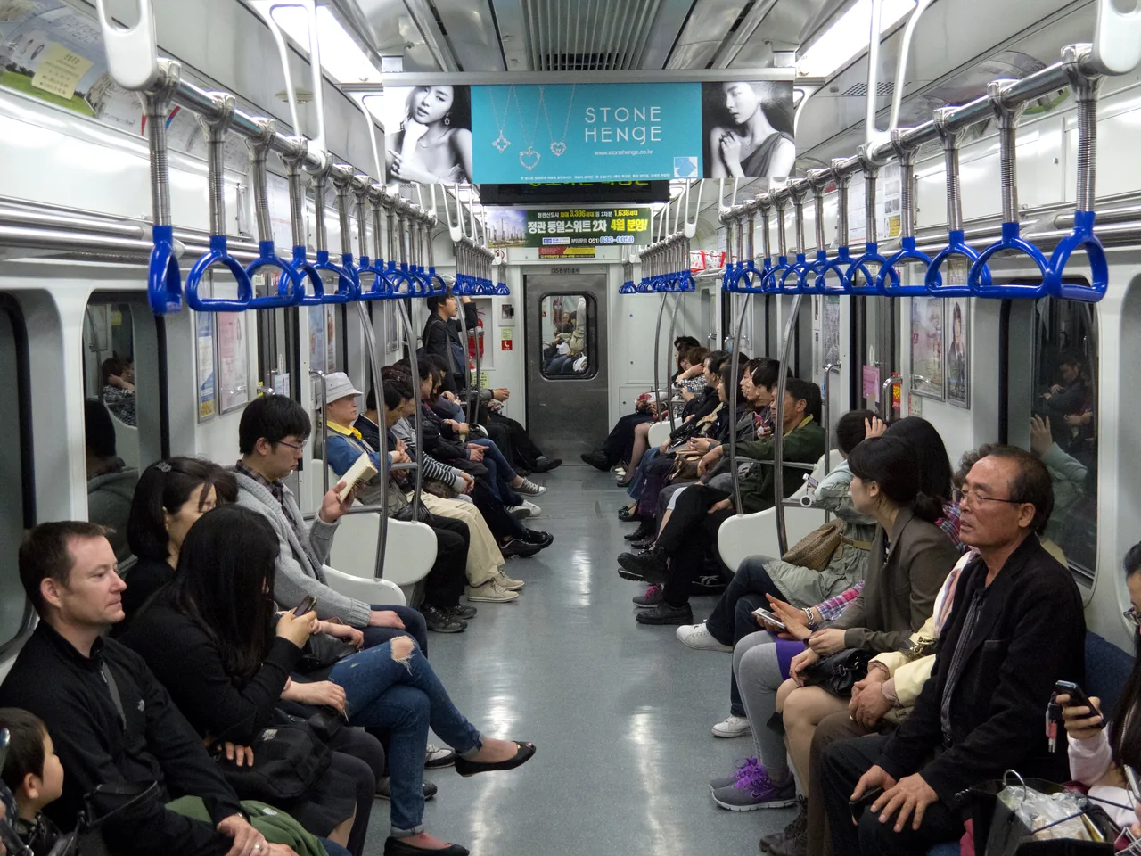 The interior of a Busan Metro Line 1 train with passengers