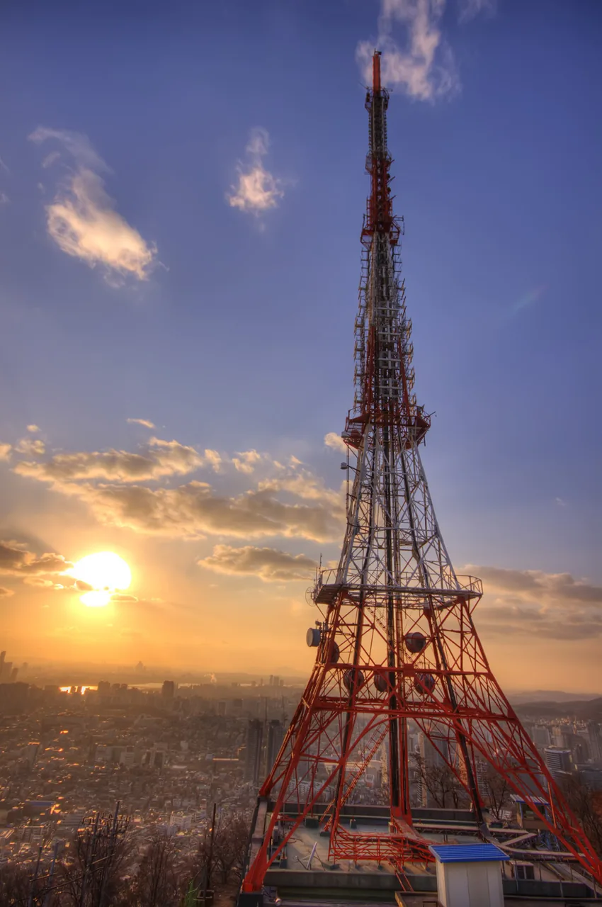 N Seoul Tower on Namsan lit at sunset