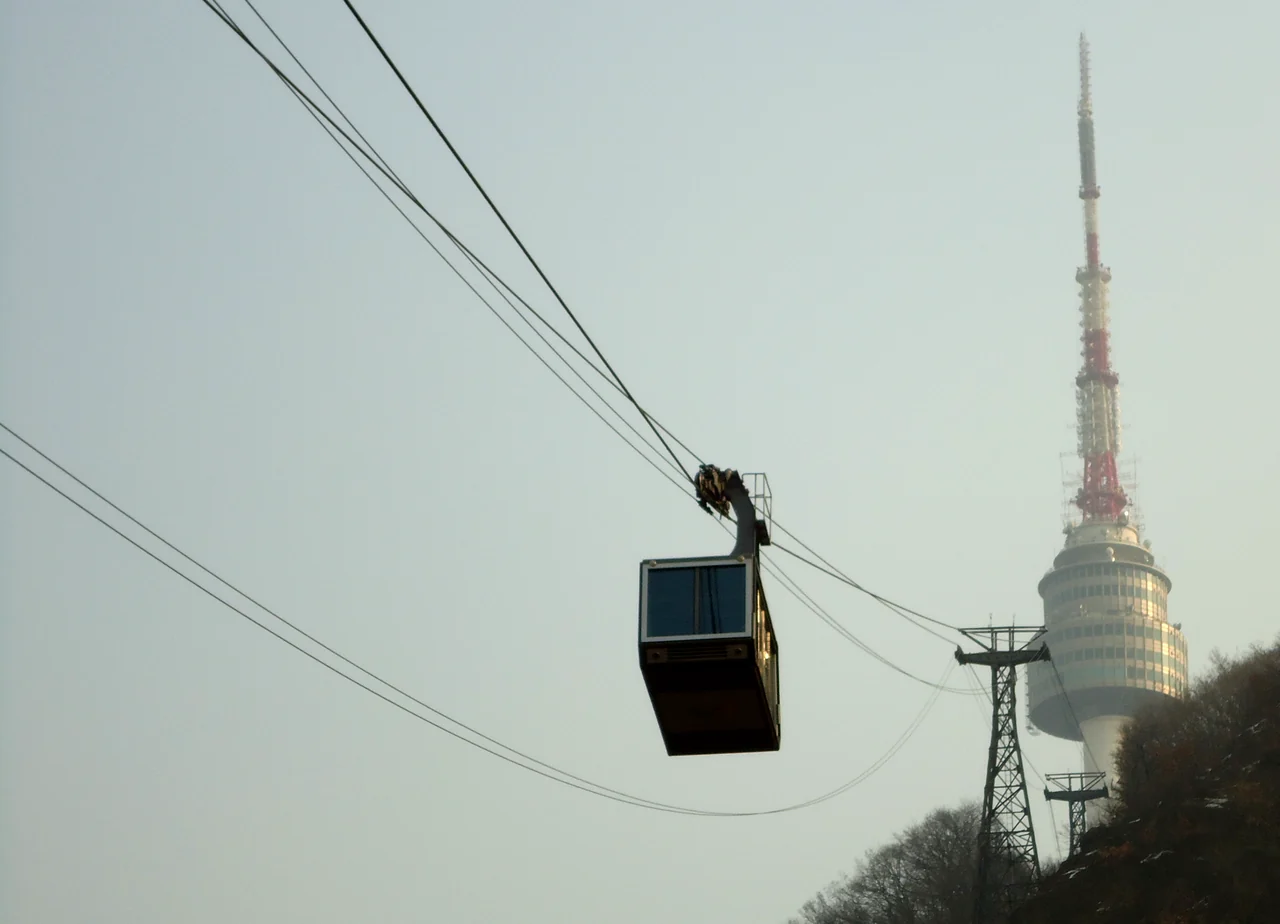 Namsan cable car climbing the wooded hillside toward N Seoul Tower