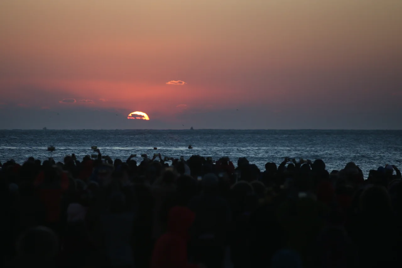 A New Year crowd on the beach in Busan at first light