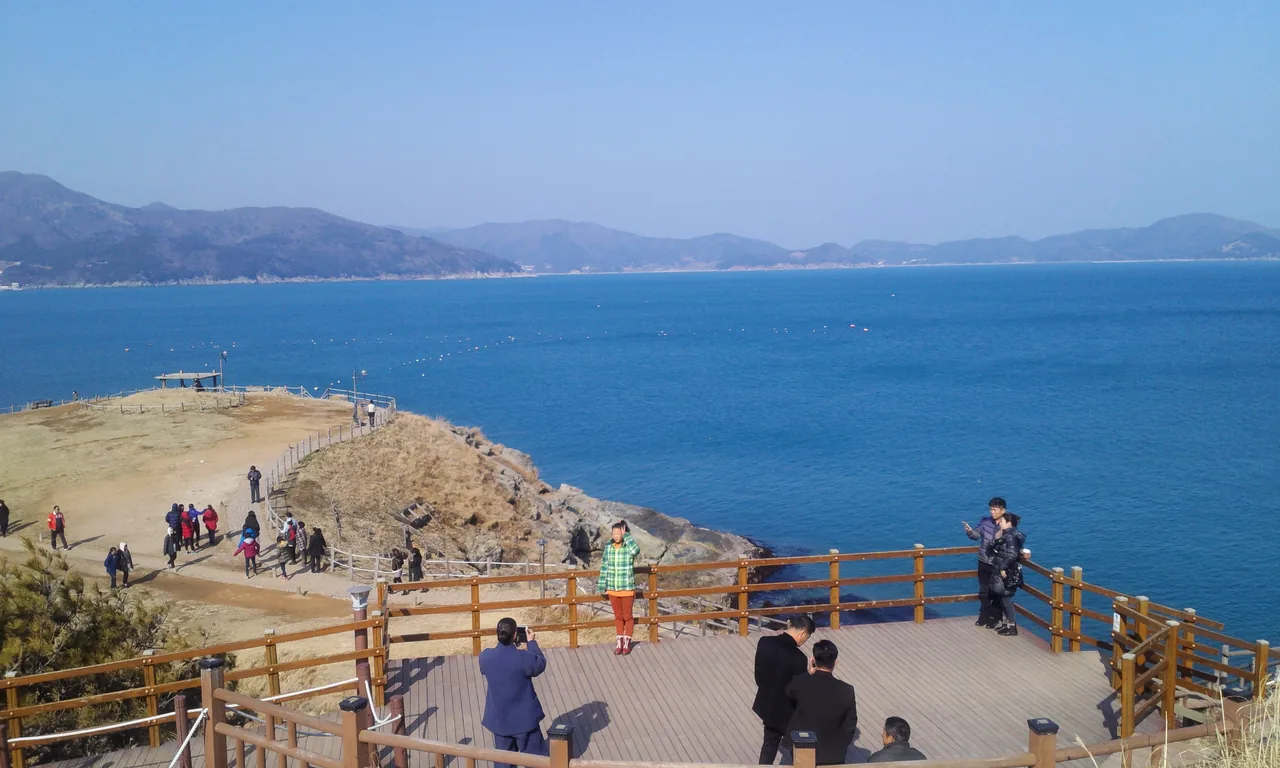 Windy Hill in Geoje overlooking the South Sea, with its white windmill on the grassy headland