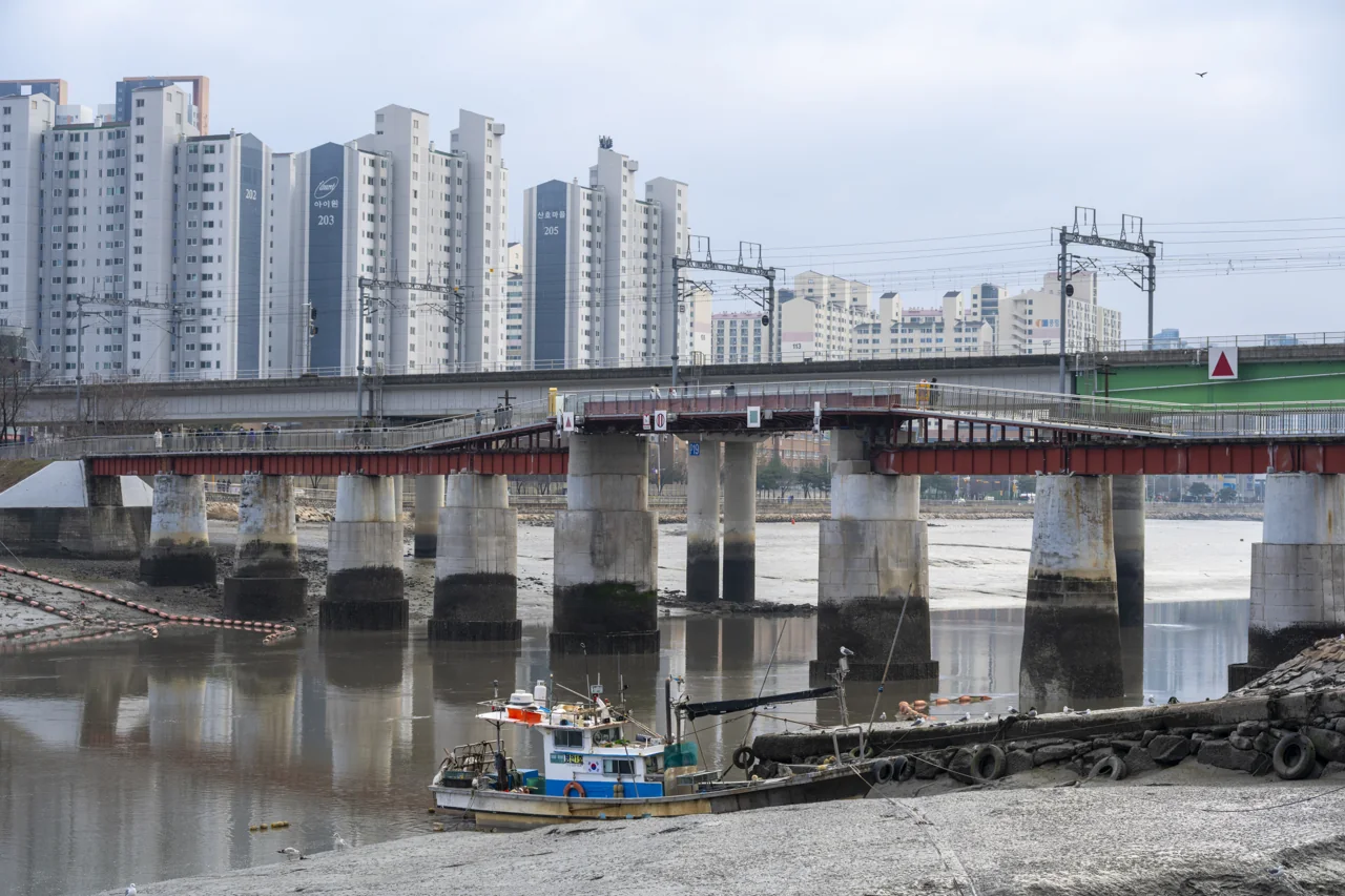 Fishing boats and the old railway bridge at Sorae Port
