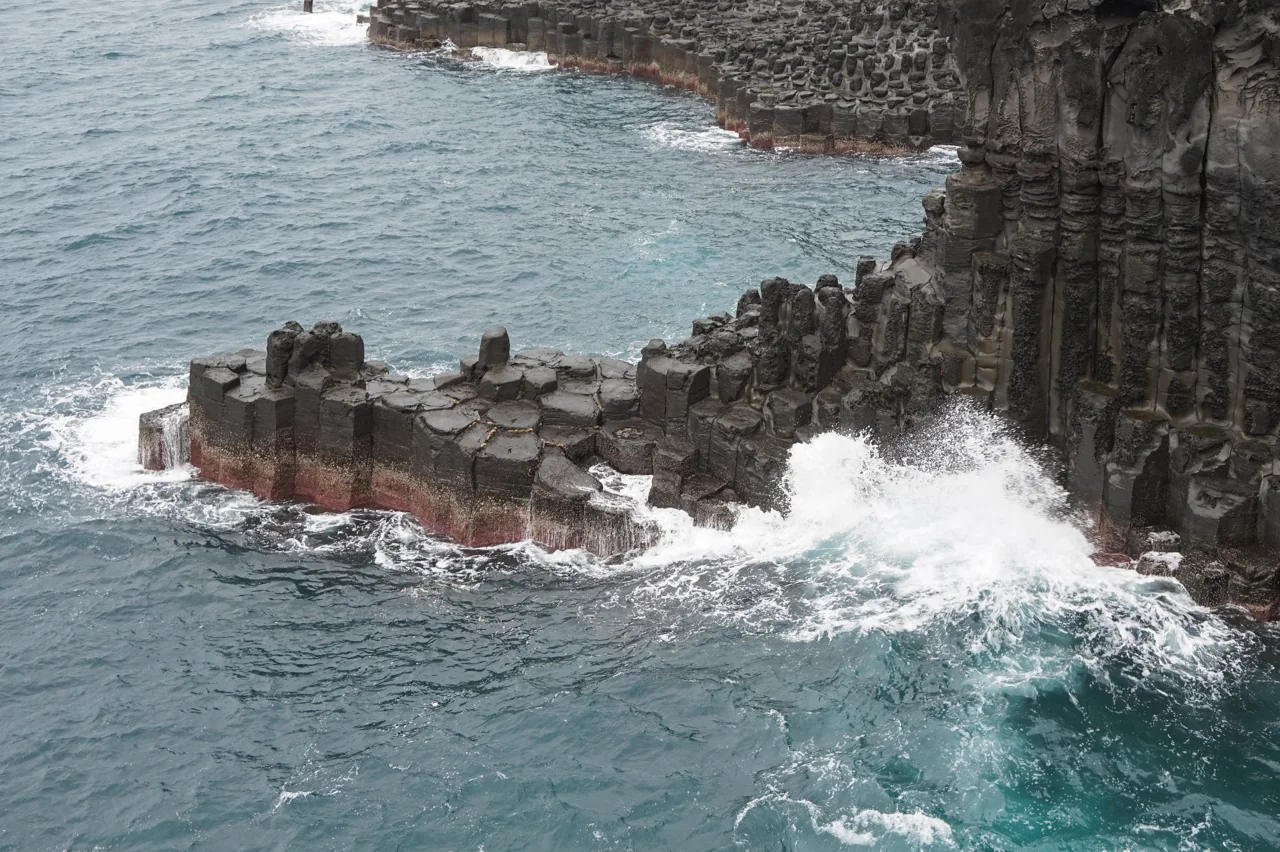 Columnar basalt cliffs at Jungmun Daepo on southern Jeju