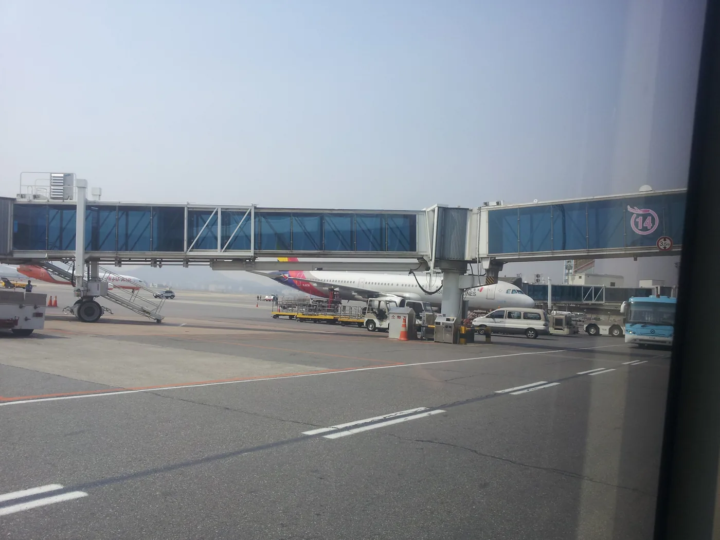 Jet bridges and a parked aircraft at Gimpo Airport
